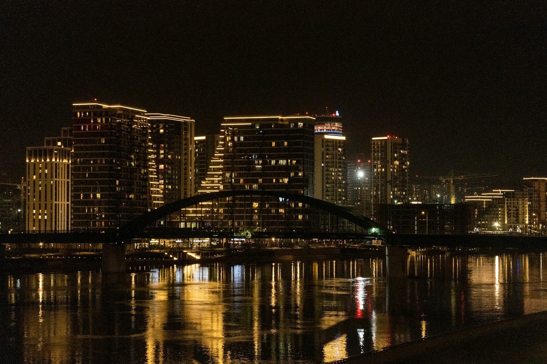 Belgrade skyline at night with a bridge over the Sava river