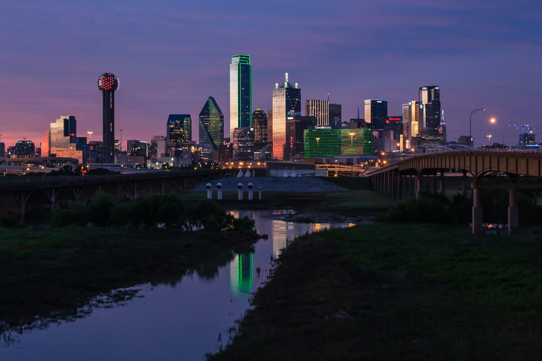 Dallas skyline at dusk reflected in water